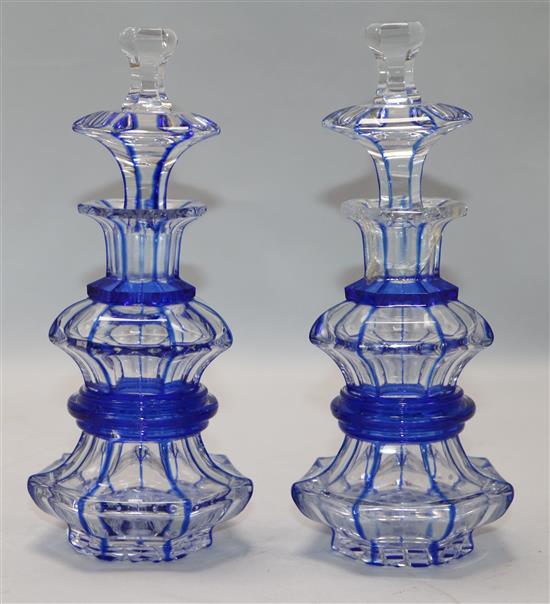 A pair of Bohemian blue flash cut glass perfume bottles H.19.5cm